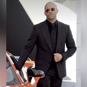 Sleek tailored Gucci black suit in perfect condition. Never worn